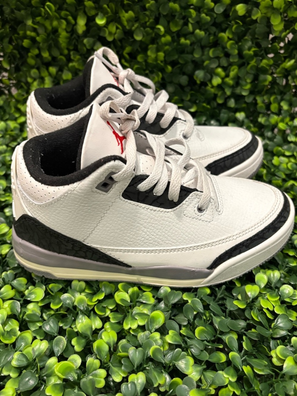Jordan White Sneakers with Black Accents and Red Logo